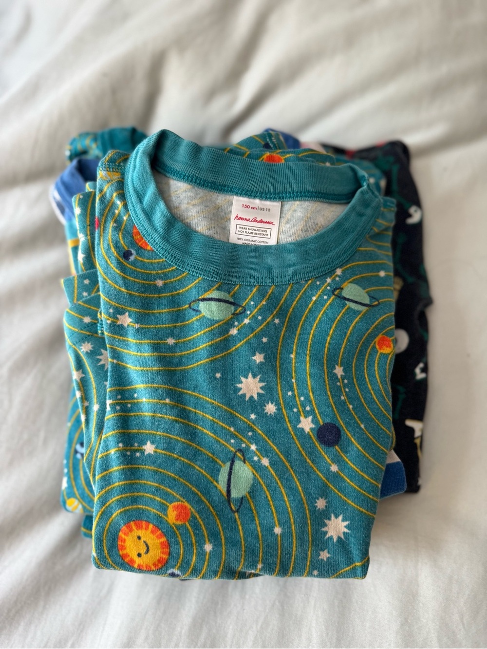 Four pairs of Hanna Andersson pyjamas in kid size 12 and 14